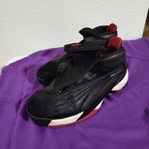 Black with red Jordans